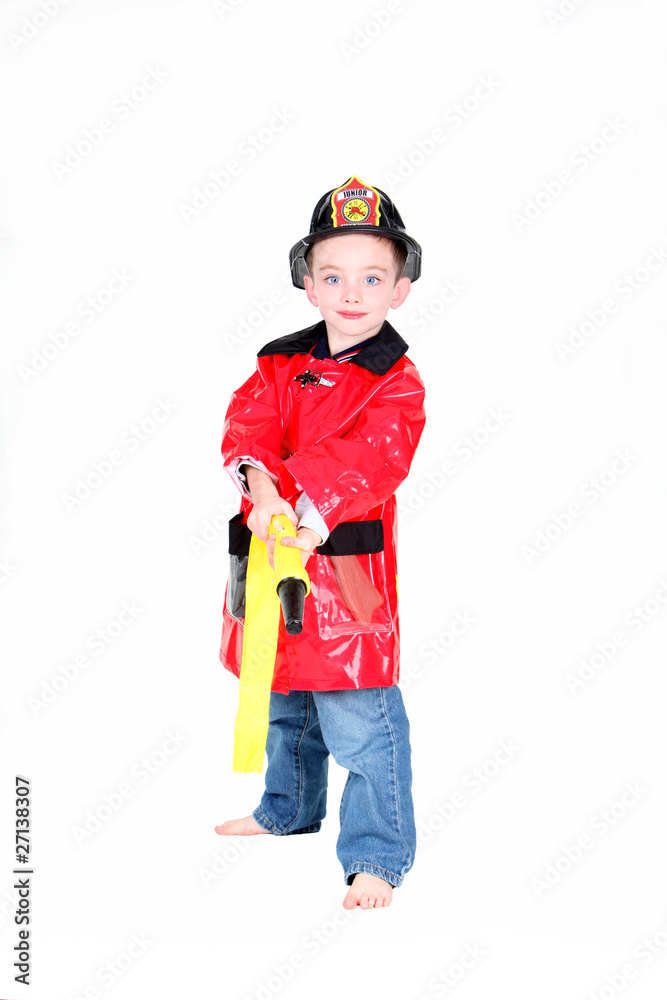 Preschool age boy in fireman costume Preschool age boy in fireman costume