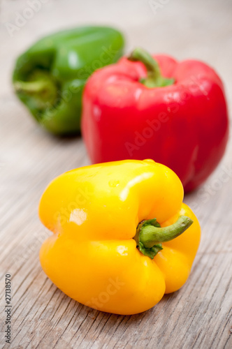 Bell peppers on wooden surface