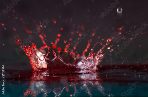 Close Up of Red and Clear Liquid Splash Crown
