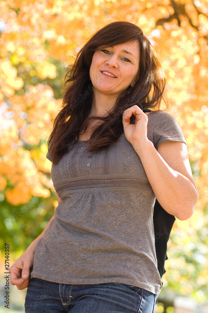 woman in park on autumn day woman in park on autumn day
