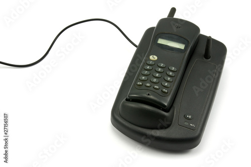 old cordless phone over a white background