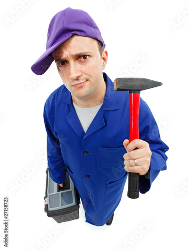Foto Awkward repairman with hammer