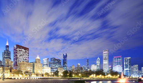 Chicago skyline at night with dramatic clouds