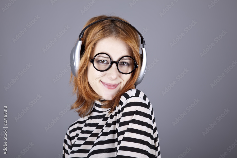Funny girl with headphone and glasses.