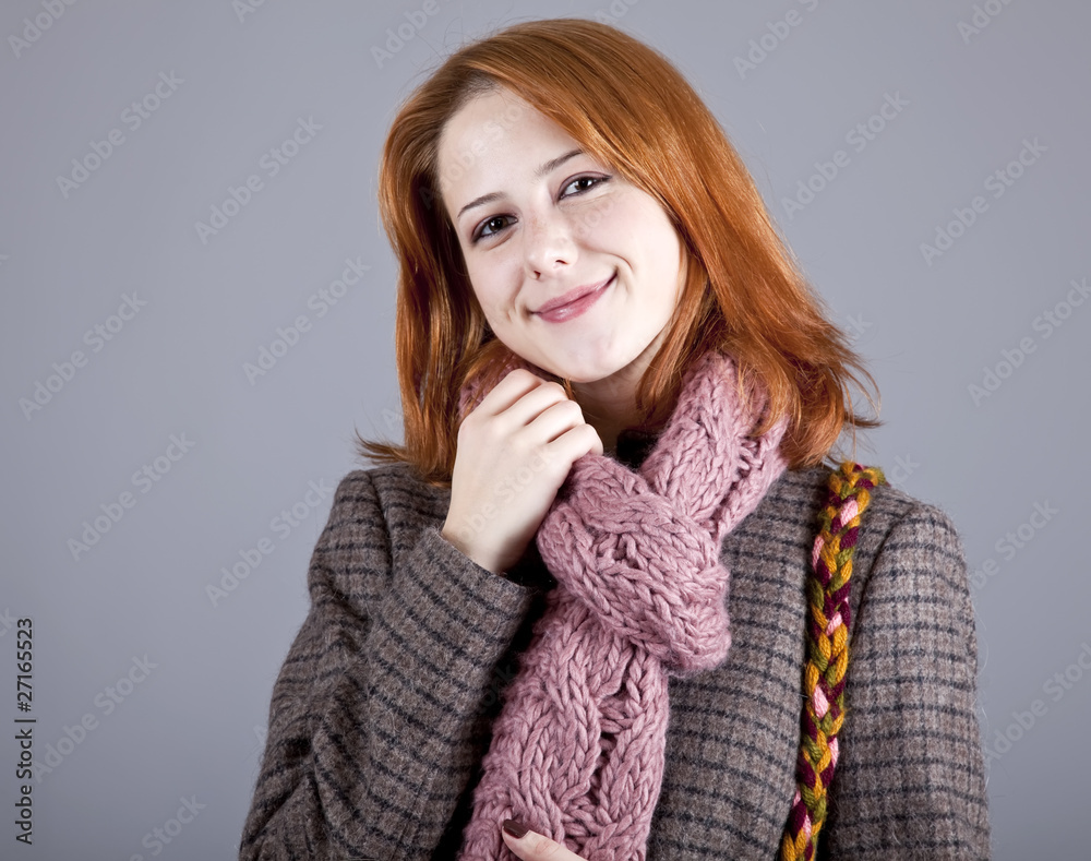 Portrait of beautiful red-haired girl in coat. Portrait of beautiful red-haired girl in coat.