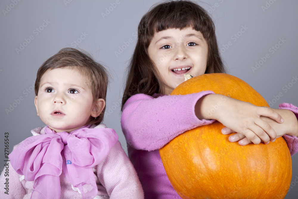 Two little sisters with pumpkin Two little sisters with pumpkin