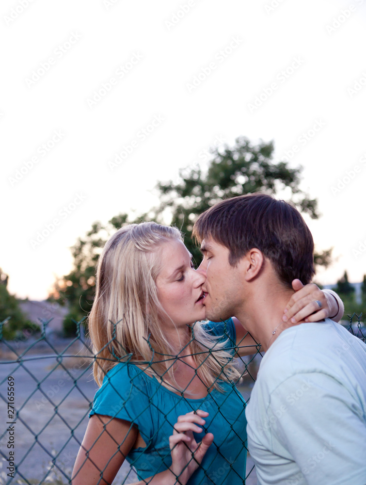 Young lovely couple kissing lovingly Young lovely couple kissing lovingly