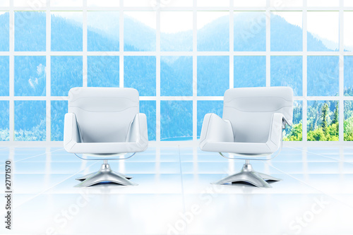 window and two armchairs in...