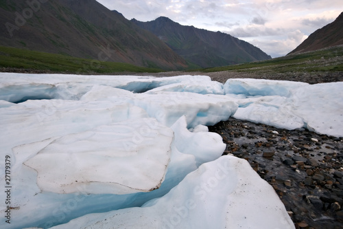 Wild landscape in Russia. Ice glacier blocks,stones. photo