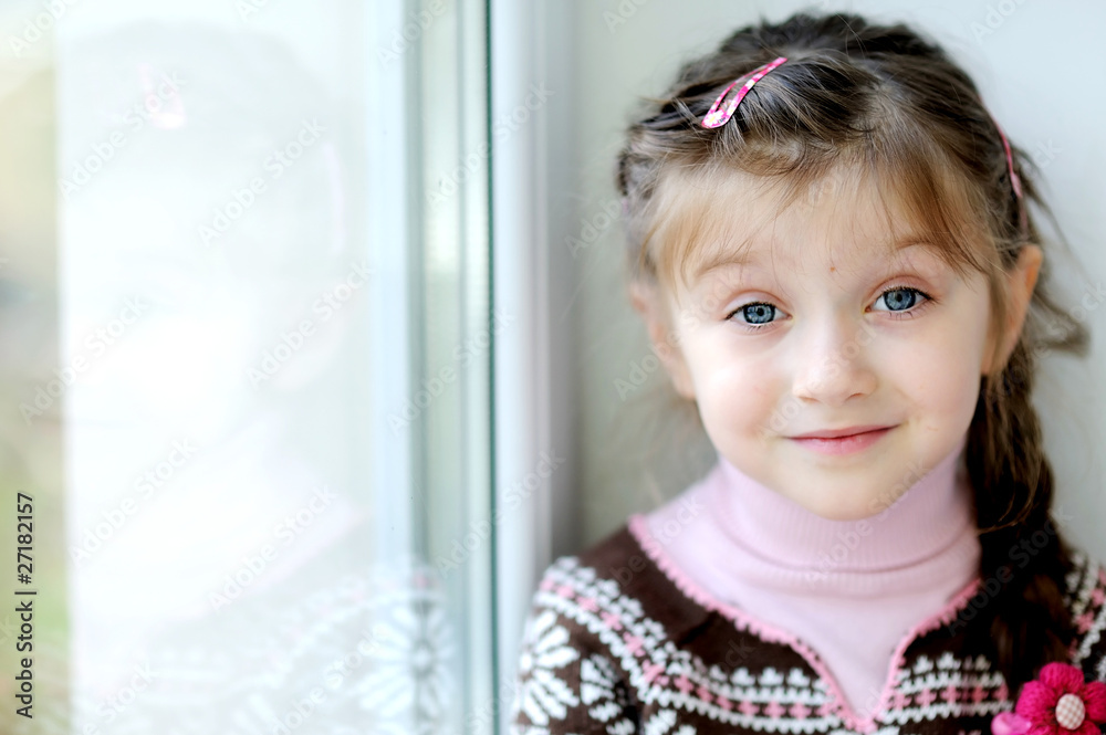 Beauty small girl with long dark braid in winter sweater Beauty small girl with long dark braid in winter sweater