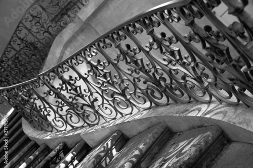 Age-old forged handrail and spiral staircase