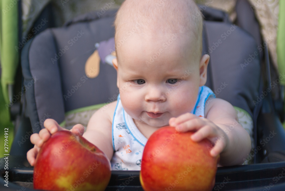 small child holding both hands two apples small child holding both hands two apples