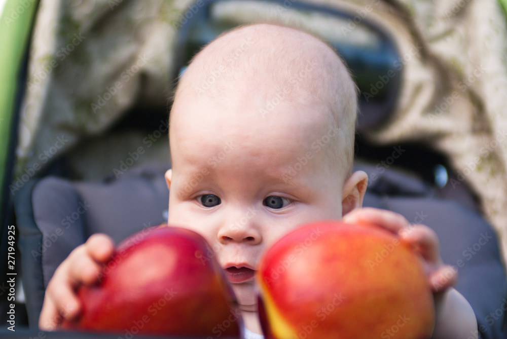 small child holding both hands two apples small child holding both hands two apples