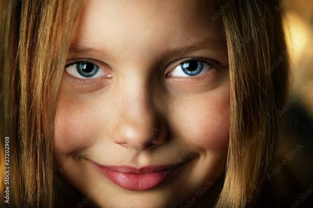 Closeup portrait of attractive smiling little girl