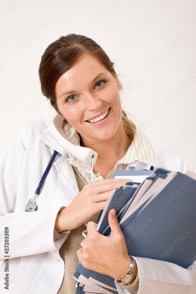 Female doctor on the phone with medical file