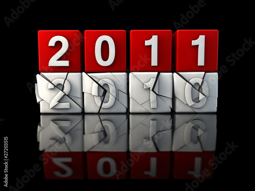 New year 2011 crashing 2010 black background photo