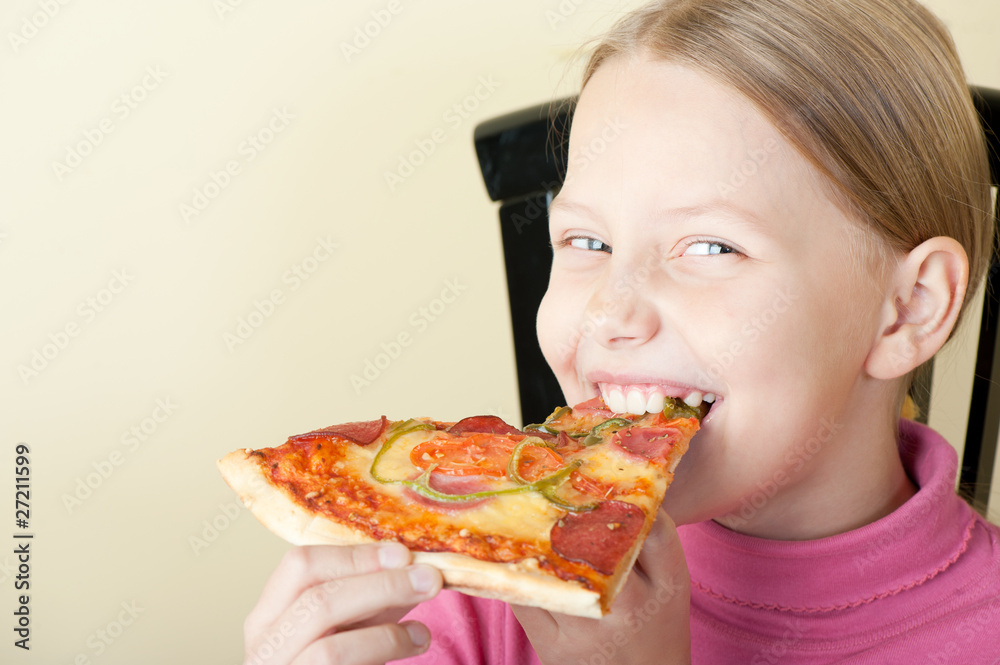 Cheerful little girl with pizza