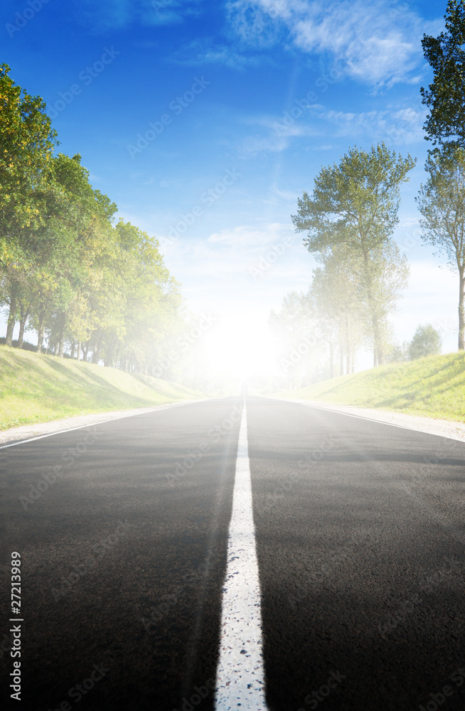 Fototapeta premium Long road to green hills.