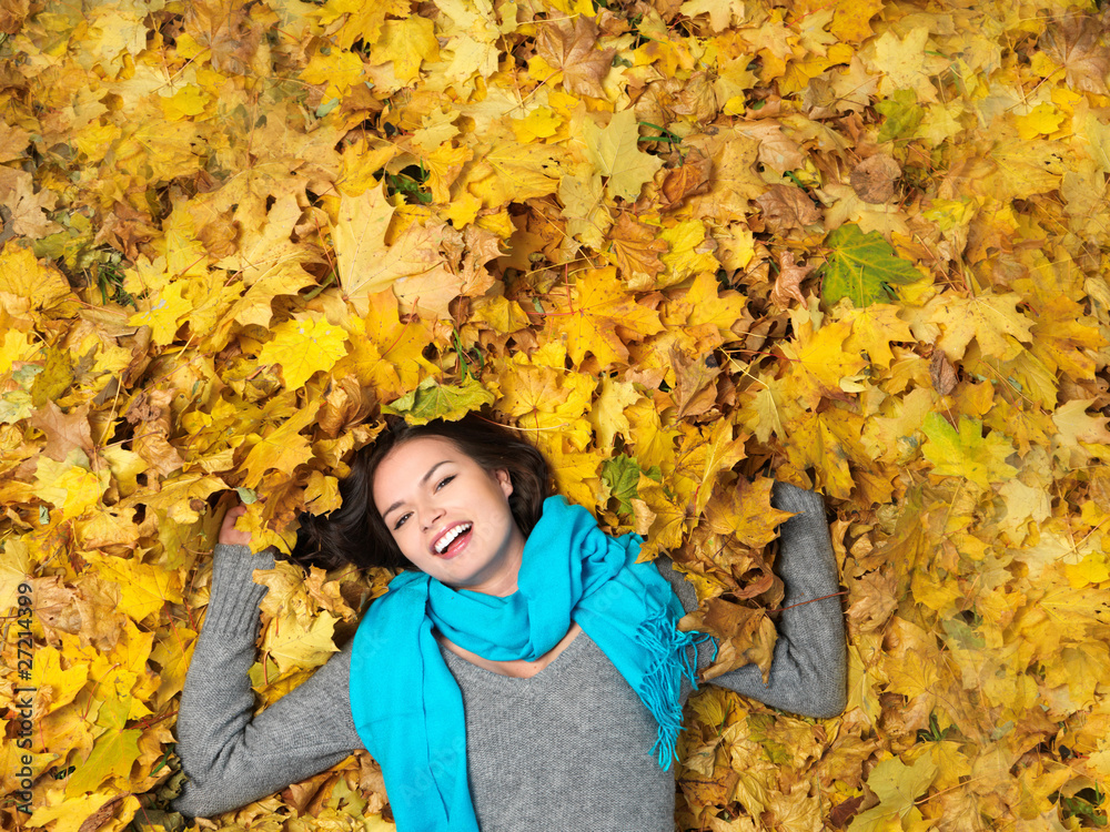 Beautiful woman spending time in park during autumn season Beautiful woman spending time in park during autumn season