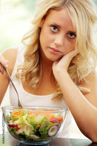 Teenage Girl Eating Smoked Salmon Salad. Model Released
