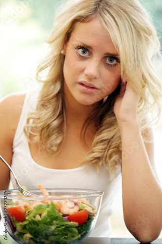 Teenage Girl Eating Prawn Salad. Model Released