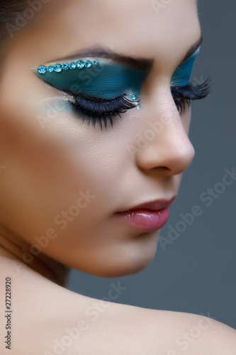 woman with bright blue make-up