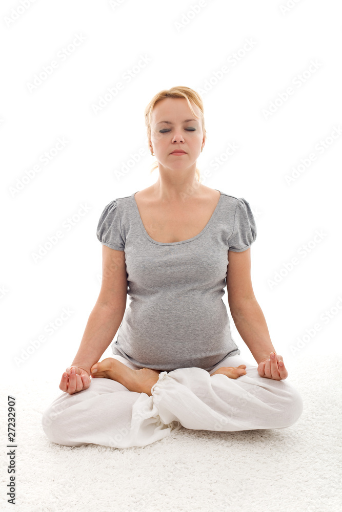 Beautiful pregnant woman doing yoga relaxation Beautiful pregnant woman doing yoga relaxation