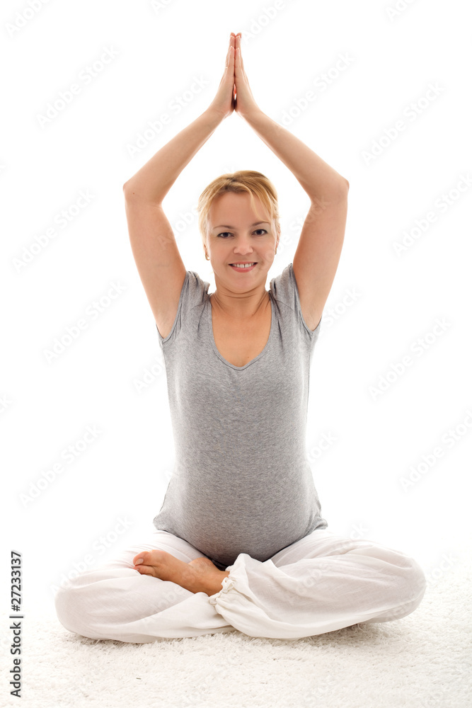 Beautiful pregnant woman doing exercises