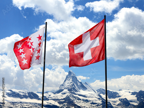 swiss flags in front of Matterhorn