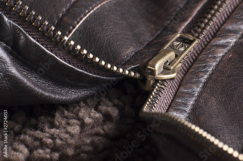 Zipper of a brown leather jacket