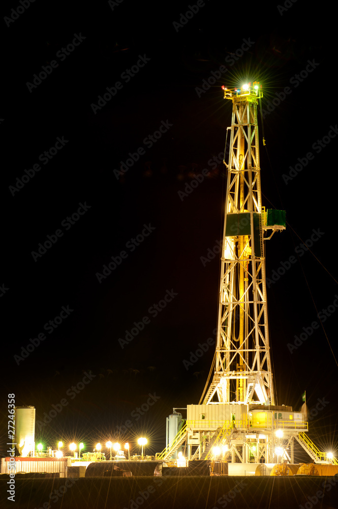 Oil derrick at night on Oklahoma plains