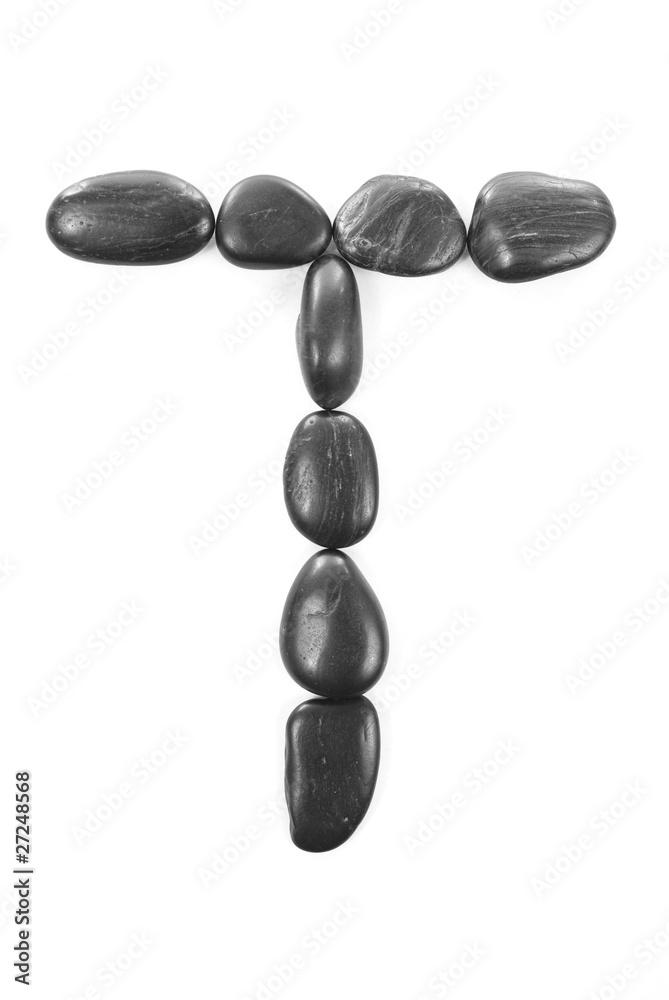 Letter 'T' made of stones isolated on white Letter 'T' made of stones isolated on white