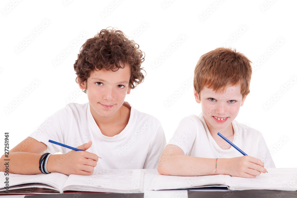 Two students with a pencil, writing Two students with a pencil, writing