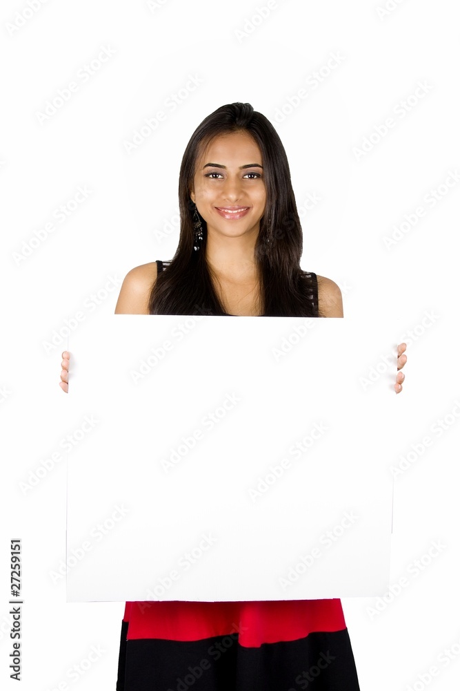 Beautiful Indian girl holding a white board. Beautiful Indian girl holding a white board.