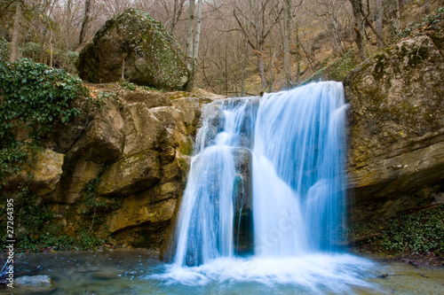 Nice waterfall in autumn forest