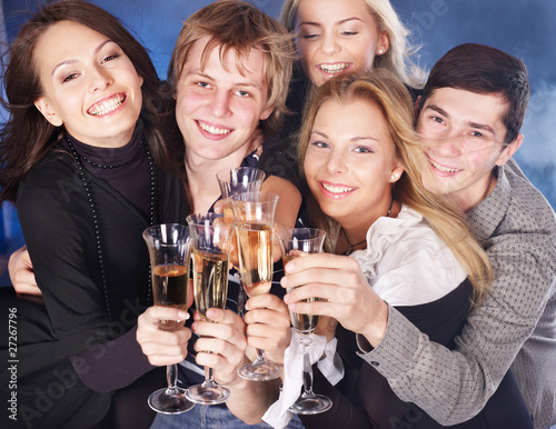 Group young people drinking champagn at nightclub.
