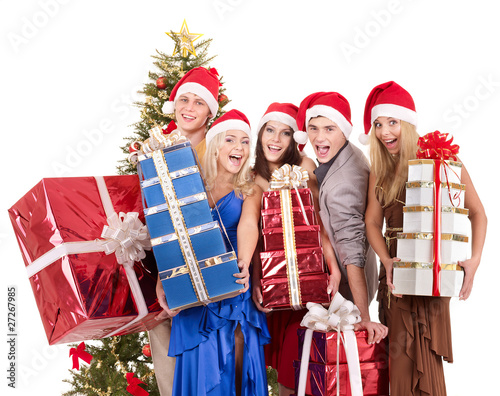 Group people in santa hat holding stack gift box.