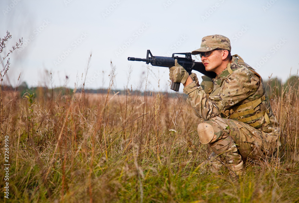 Fototapeta premium Soldier with a rifle