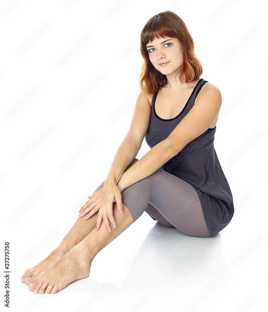 girl is sitting on the floor.