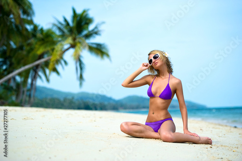 Beautiful young woman relaxing on the beach