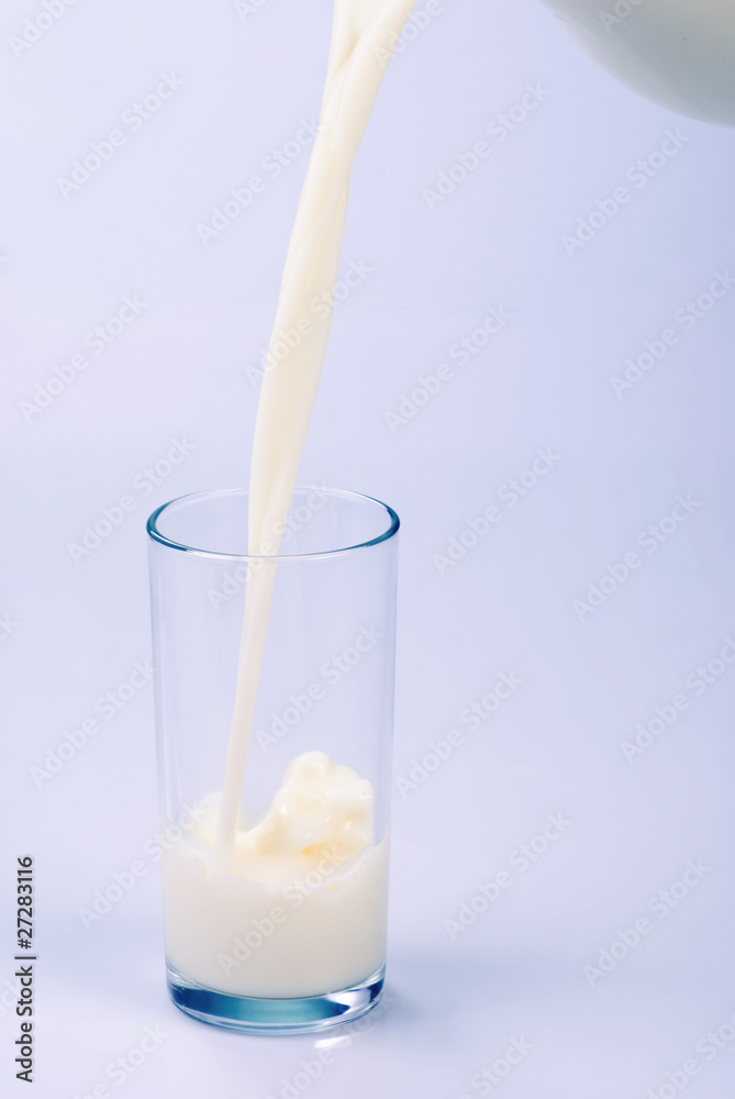 Milk pouring into the glass Milk pouring into the glass