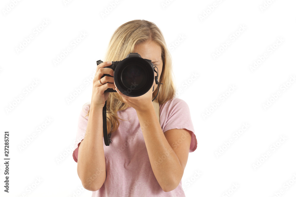 Young woman with camera taking a picture Young woman with camera taking a picture