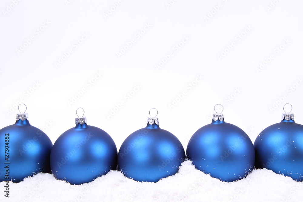 Blue matt christmas balls on snow, with space for your text Blue matt christmas balls on snow, with space for your text