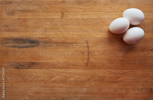 Three Eggs on a Butcher Block Counter