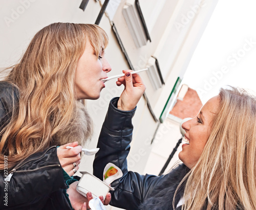 Two friends feading each other