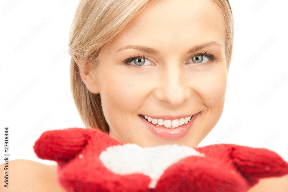 beautiful woman in red mittens with snow
