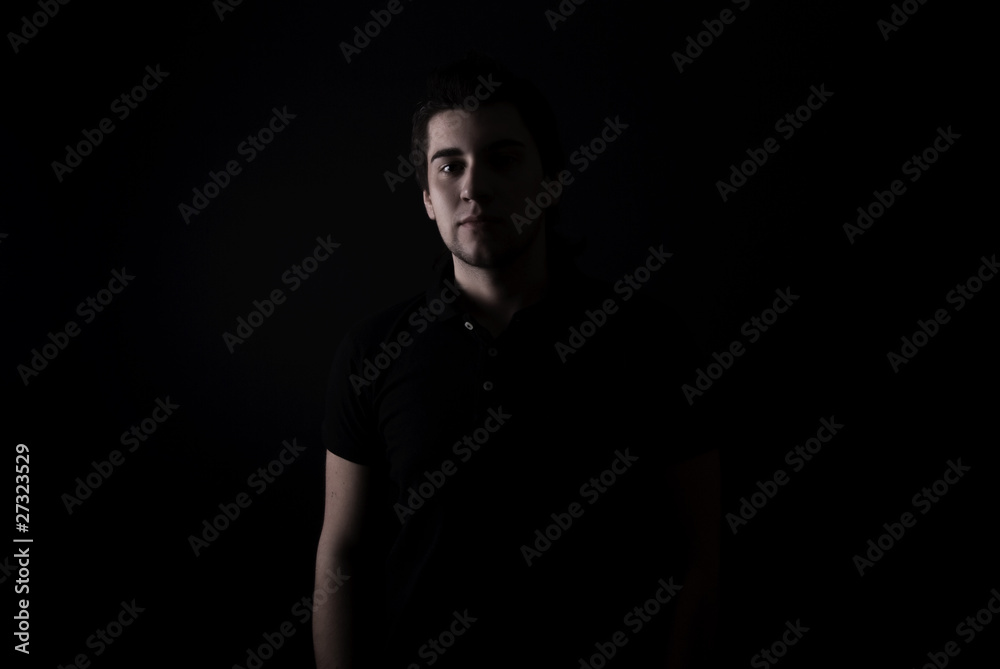 portrait of a young man in the darkness
