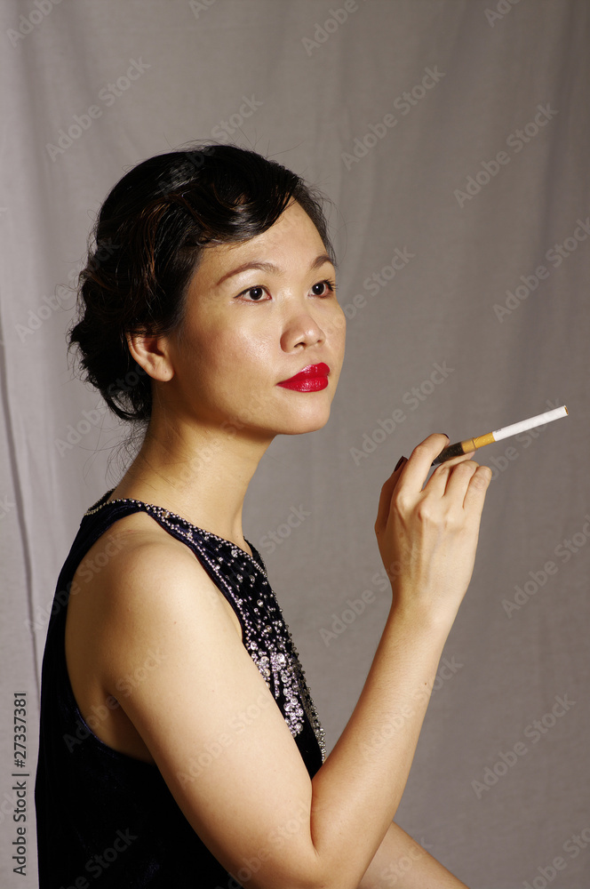 Obraz premium woman smokes in studio