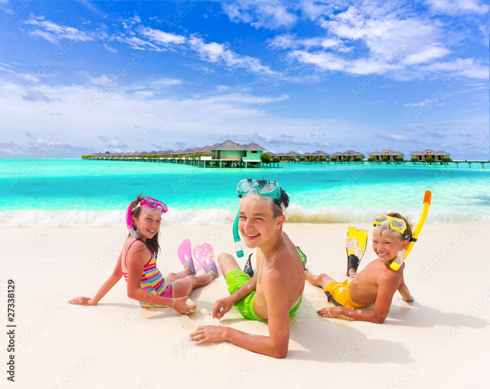 Fototapeta premium Three kids on the beach