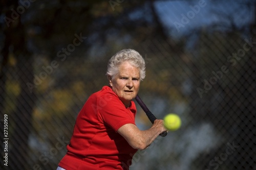 Woman Ready To Hit Tennis Ball © Vibe Images